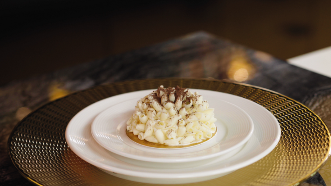 image of a well decorated small cake on a plate