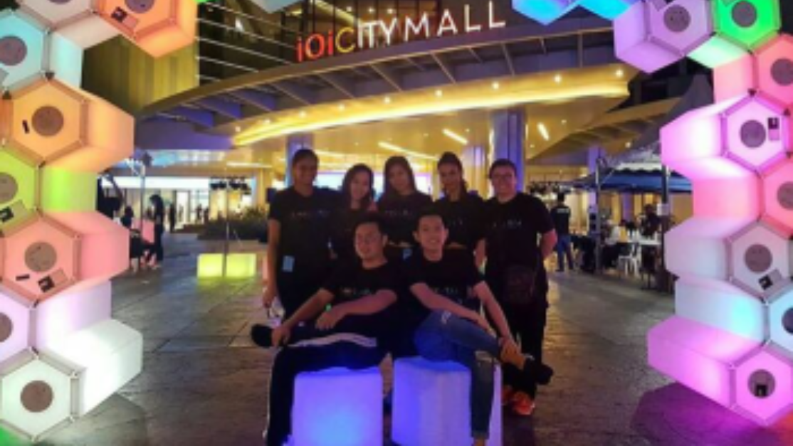 students posing inside ioi city mall