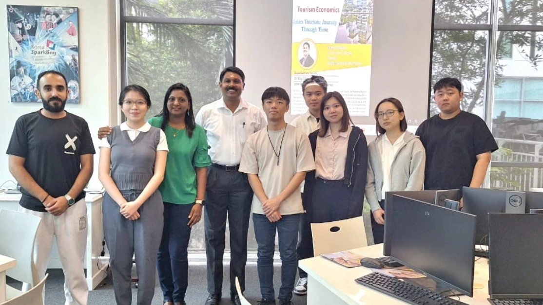 students posing with lecturer from India