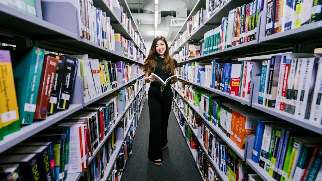 Taylor's law student in the library