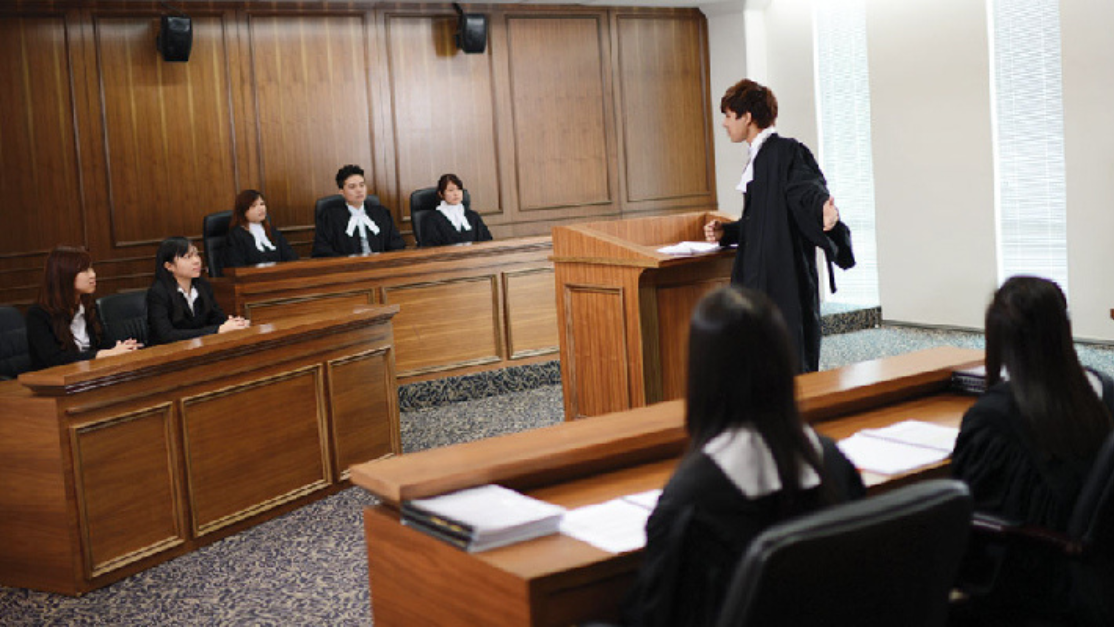 students in a mooting simulation in a mock court