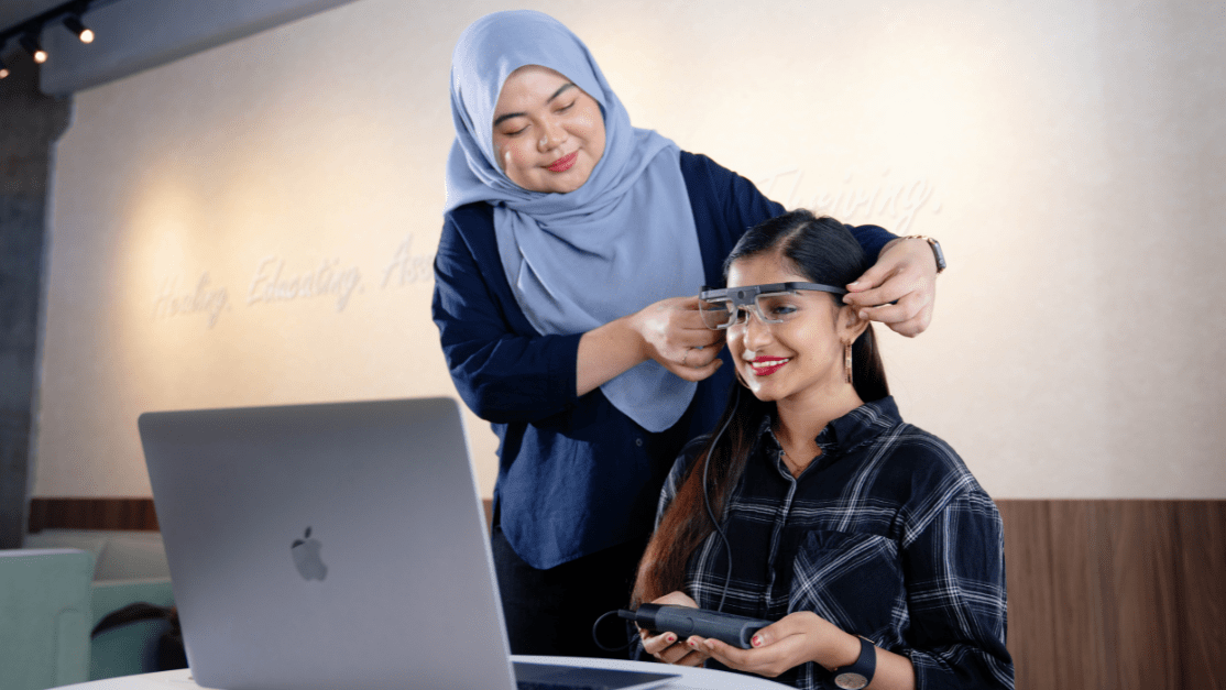 Taylor's lecturer and student using the equipment