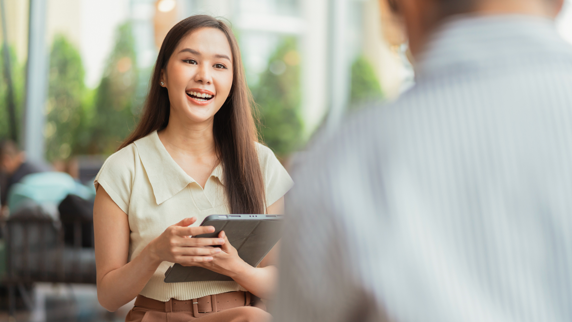 Master of Counselling student engaging in a supportive one-to-one conversation in a professional setting