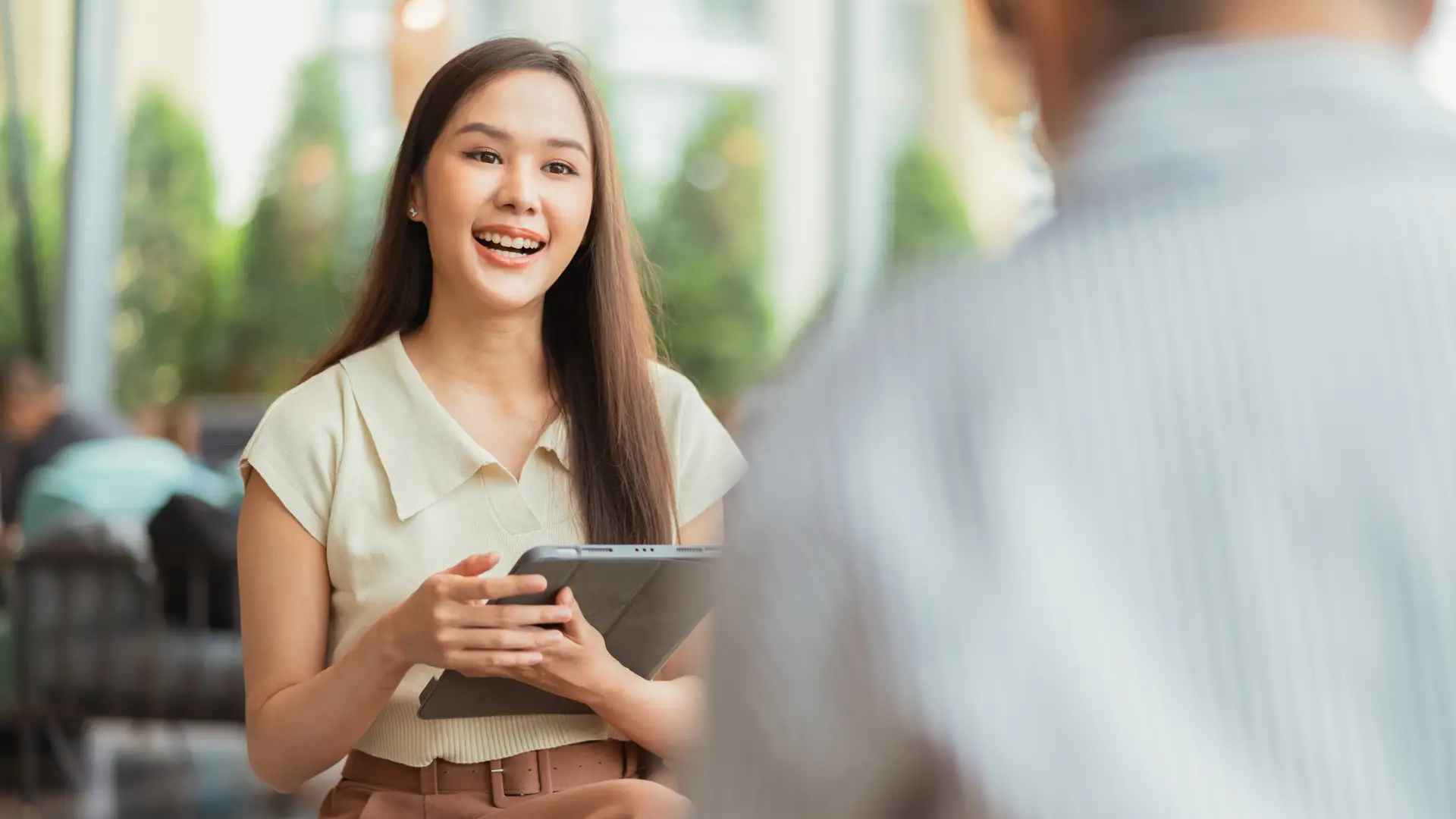 Master of Counselling student engaging in a supportive one-to-one conversation in a professional setting