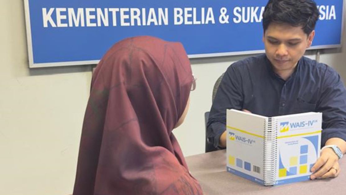 taylors student in an interview while holding a book