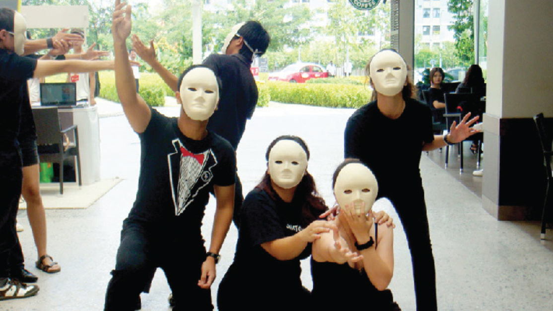 art performance of students wearing masks