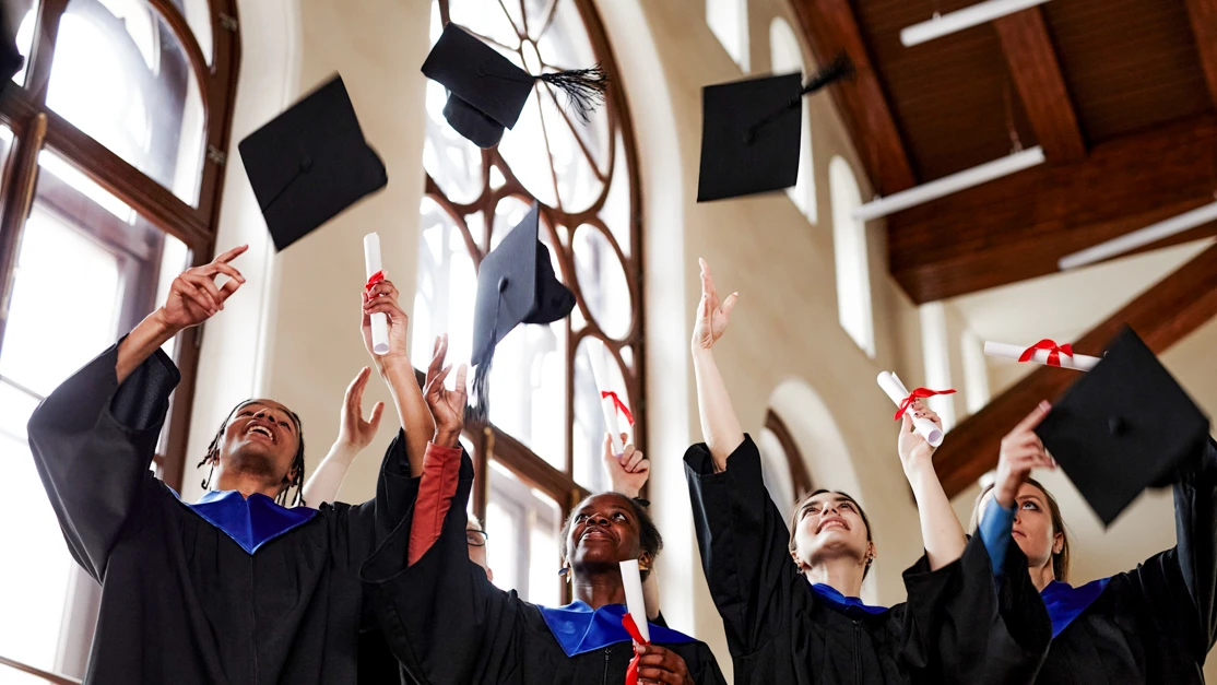 Taylor's student participating in the graduation ceremony 