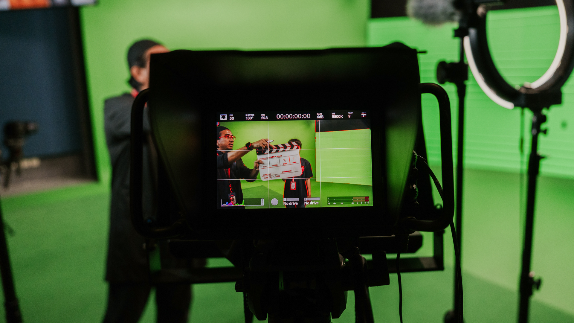 Taylor’s media students recording a production in green screen studio