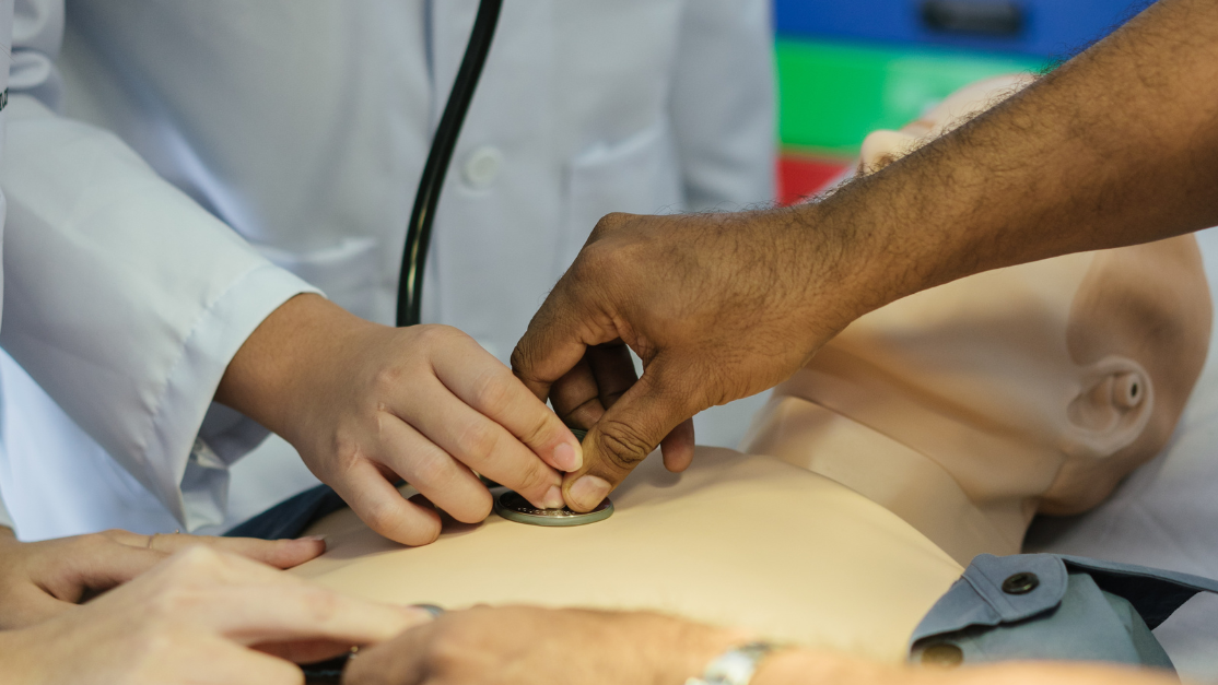 Taylor's Medical lecturer demonstrating usage of stethoscope
