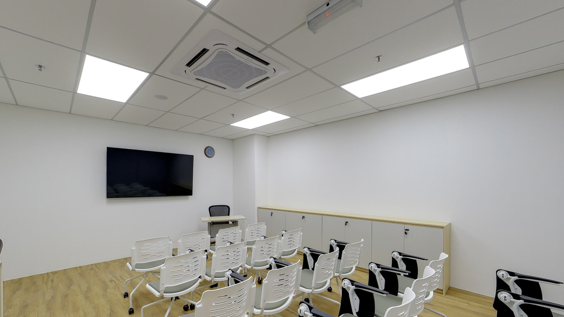 Multipurpose examination room at Taylor’s Clinical School set up with chairs and a wall-mounted screen