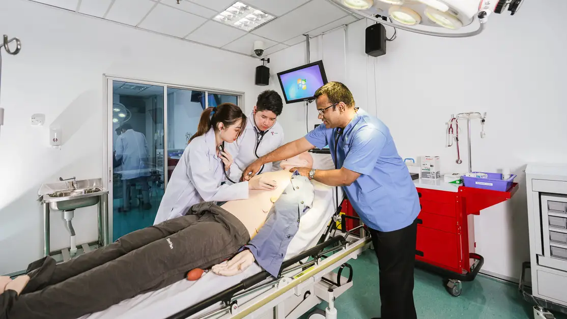Taylor's medical lecturer demonstrating cardiopulmonary resuscitation to student