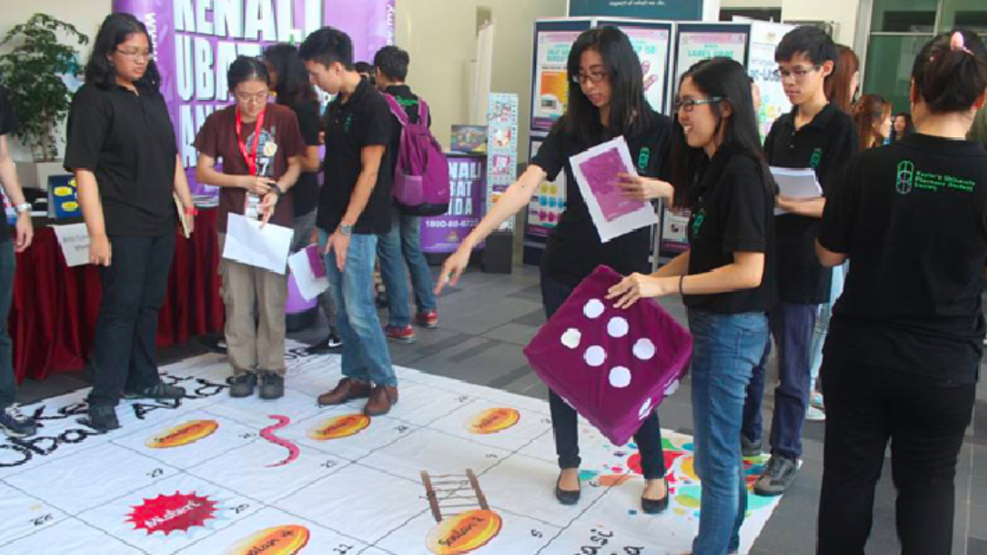 Visitors in front of the pharmacy awareness booth