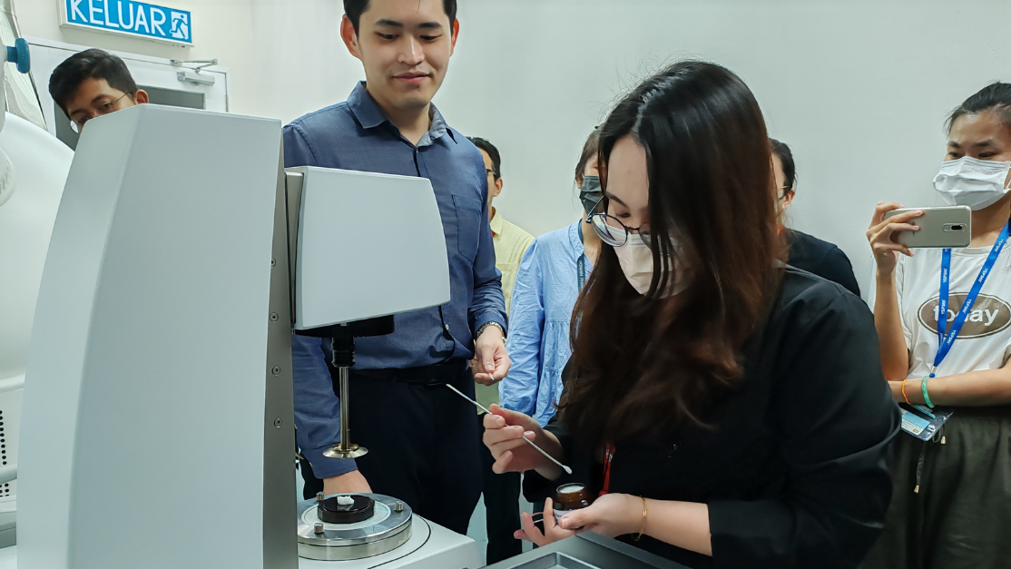 Taylor's Pharmacy student trying the rheometer