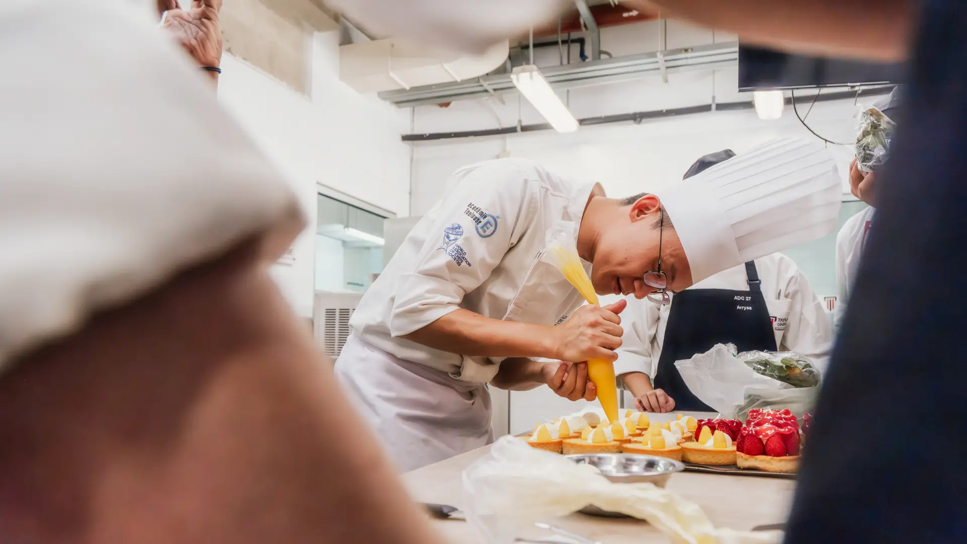 Taylor's culinary students working together on food preparation