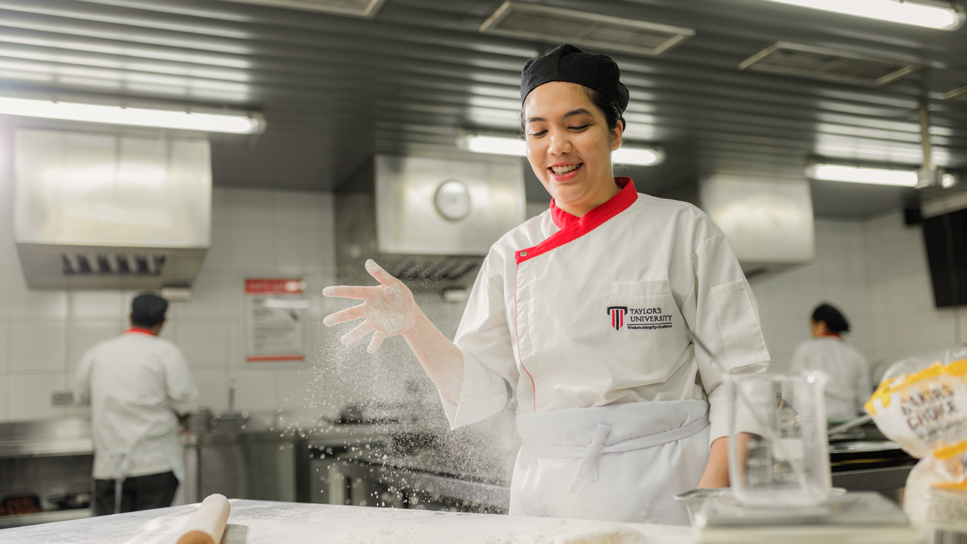 Culinary student working with flour