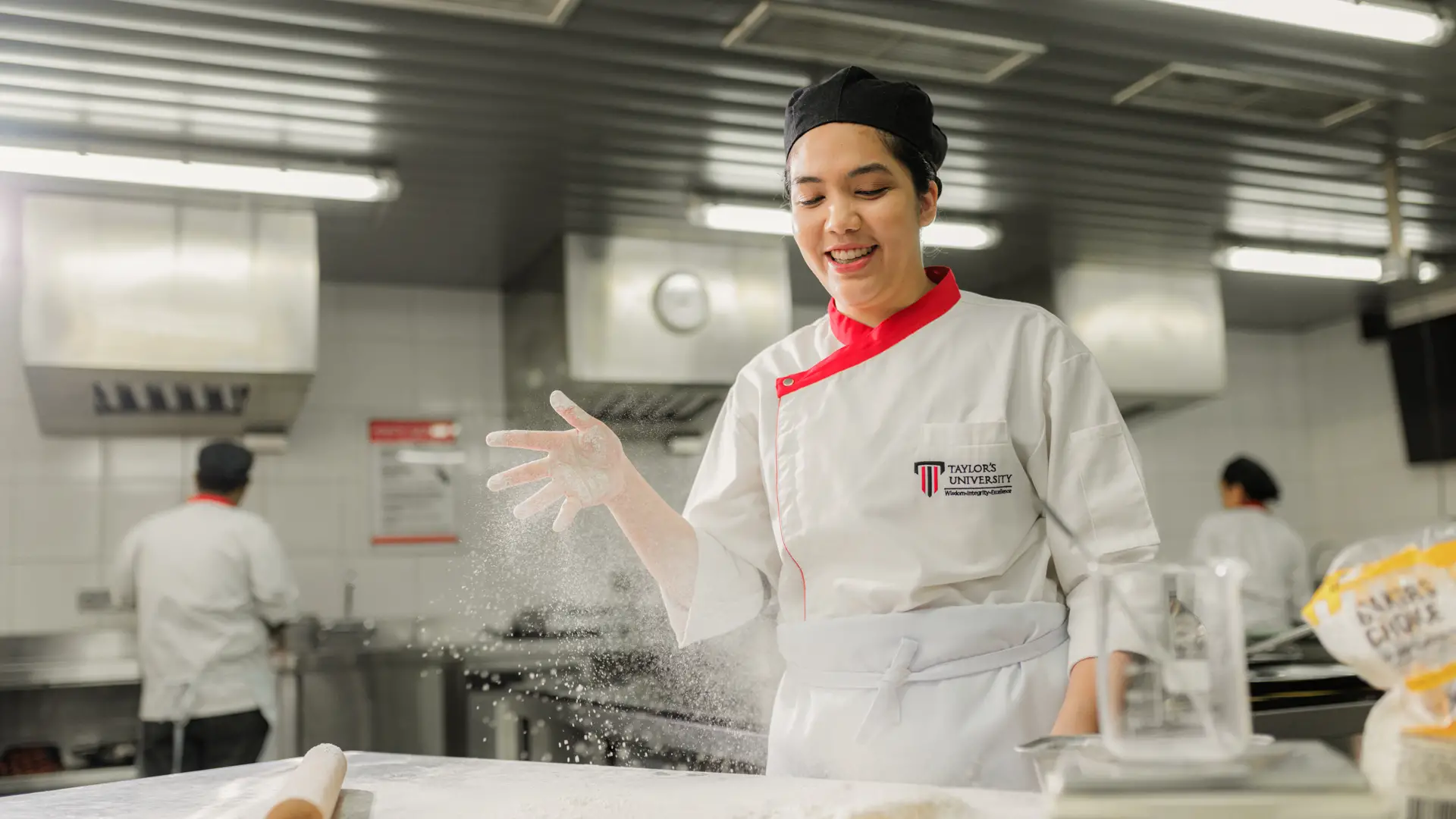 Culinary student working with flour