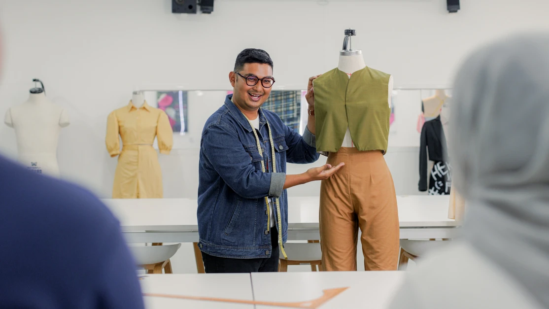 Taylor's design doctoral student presenting his final works