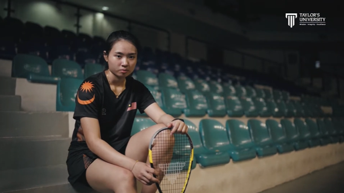 portrait of yiwen holding a tennis racket